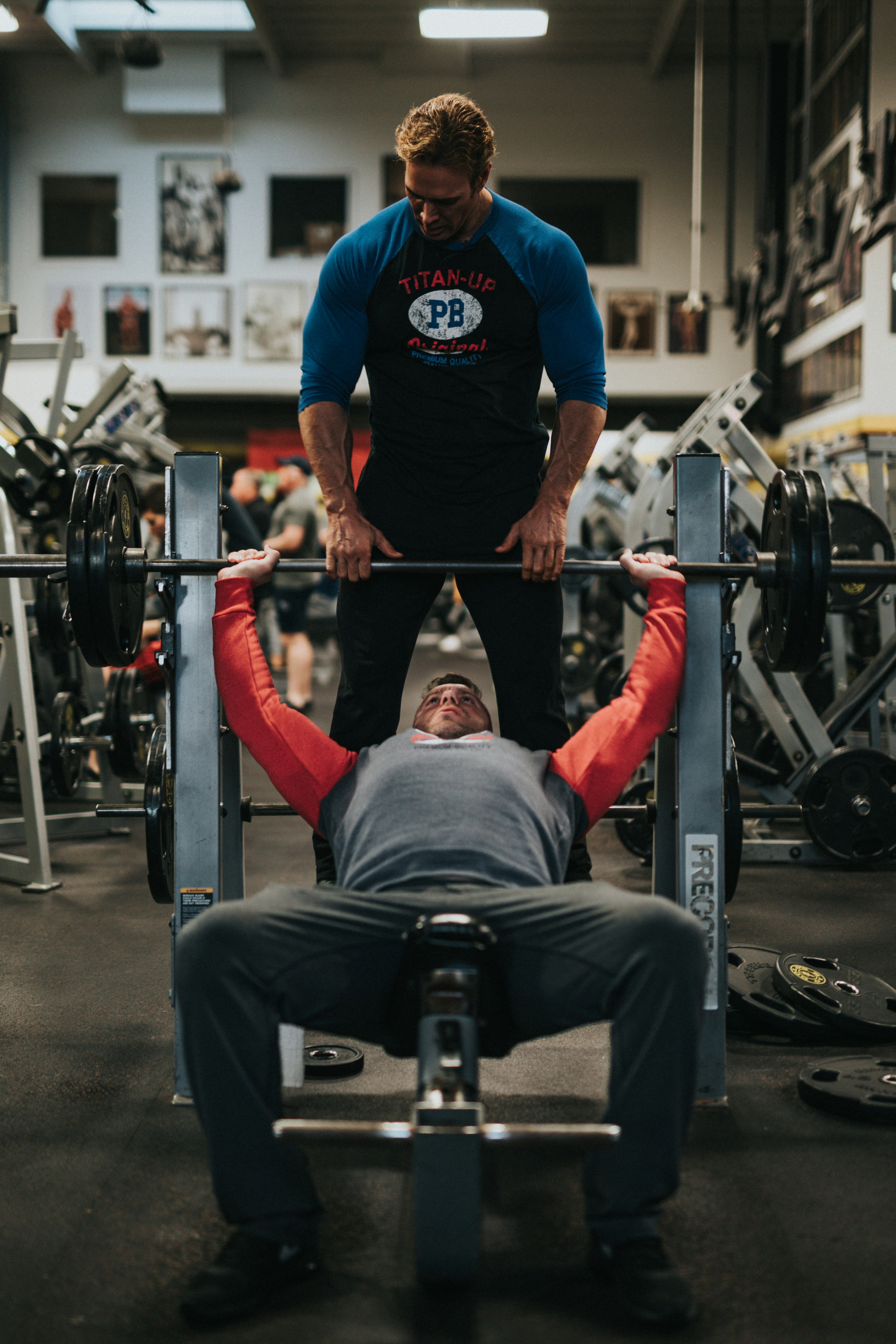 Member training with a spotter at Iron Legion